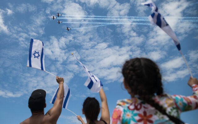 People at Bograshov Beach in Tel Aviv watch the military airshow on Israel's 71st Independence Day, May 9, 2019 (Hadas Parush/Flash90) People at Bograshov Beach in Tel Aviv watch the military airshow on Israel's 71st Independence Day, May 9, 2019 (Hadas Parush/Flash90)