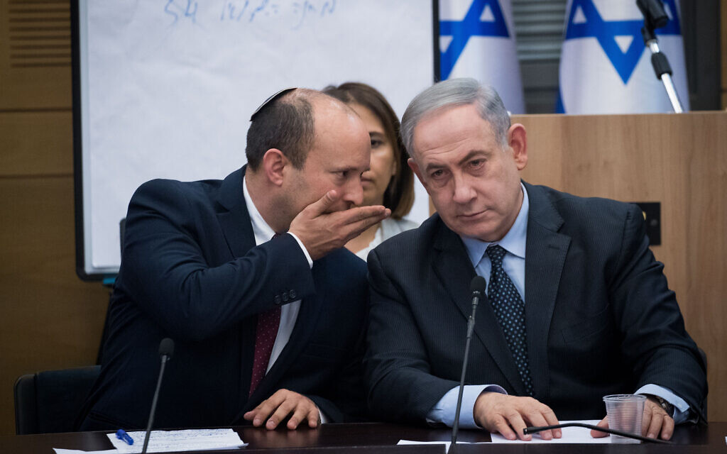 Defense Minister Naftali Bennett (L) of Yamina speaks to Prime Minister Benjamin Netanyahu during a meeting with leaders of right-wing parties at the Knesset in Jerusalem, March 4, 2020. (Yonatan Sindel/Flash90) Defense Minister Naftali Bennett (L) of Yamina speaks to Prime Minister Benjamin Netanyahu during a meeting with leaders of right-wing parties at the Knesset in Jerusalem, March 4, 2020. (Yonatan Sindel/Flash90)