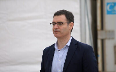 Health Ministry Director General Moshe Bar Siman-Tov is seen at a drive-through site for coronavirus testing samples collection, in Tel Aviv, on March 20, 2020. (Gili Yaari/Flash90)
