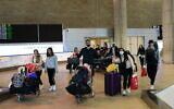 Illustrative photo of Israeli travelers arriving at Ben Gurion airport on March 23, 2020. (Tomer Neuberg/Flash90)