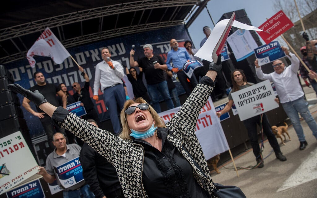 Self-employed Israelis take part in a protest outside the Knesset on March 30, 2020, amid the coronavirus outbreak. (Yonatan Sindel/Flash90) Self-employed Israelis take part in a protest outside the Knesset on March 30, 2020, amid the coronavirus outbreak. (Yonatan Sindel/Flash90)