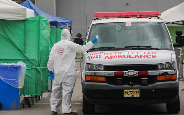 The Israeli Magen David Adom national emergency service at a coronavirus testing complex in Bnei Brak on April 1, 2020. (Yossi Zamir/Flash90) The Israeli Magen David Adom national emergency service at a coronavirus testing complex in Bnei Brak on April 1, 2020. (Yossi Zamir/Flash90)