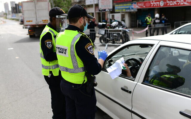 Police officers at a checkpoint located at the entrance to the ultra-Orthodox city of Bnei Brak, April 5, 2020. (Tomer Neuberg/ Flash90) Police officers at a checkpoint located at the entrance to the ultra-Orthodox city of Bnei Brak, April 5, 2020. (Tomer Neuberg/ Flash90)