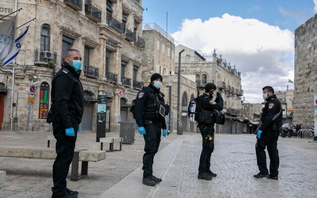 Police officers at a temporary checkpoint in Jerusalem on April 8, 2020 (Olivier Fitoussi/Flash90) Police officers at a temporary checkpoint in Jerusalem on April 8, 2020 (Olivier Fitoussi/Flash90)