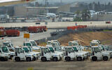 Parking airplanes and other equipment at Ben Gurion airport on April 6, 2020. (Moshe Shai/FLASH90)