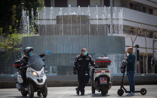Israeli police patrol in Dizengoff square in Tel Aviv to check people are not disobeying the government's orders on a partial lockdown in order to prevent the spread of the coronavirus, April 14, 2020. (Miriam Alster/Flash90) Israeli police patrol in Dizengoff square in Tel Aviv to check people are not disobeying the government's orders on a partial lockdown in order to prevent the spread of the coronavirus, April 14, 2020. (Miriam Alster/Flash90)