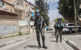 Border Police officers enforce a curfew in the ultra Orthodox Jewish neighborhood of Mea Shearim in Jerusalem, April 16, 2020. (Yonatan Sindel/Flash90)