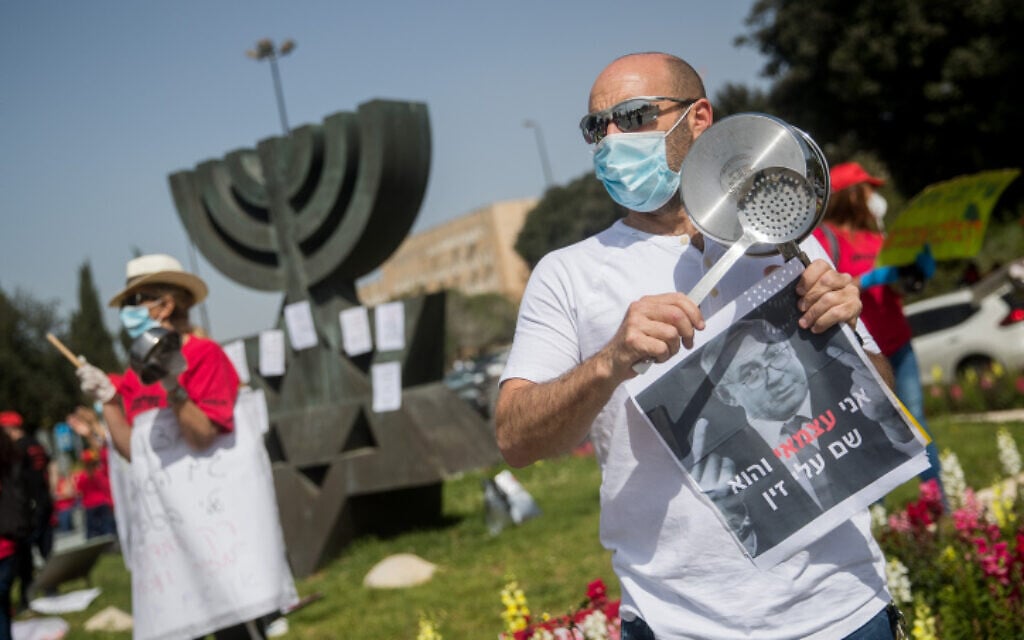 Israeli self-employed and small business owners participate in a rally calling for financial support from the government outside the Knesset in Jerusalem, on April 19, 2020. (Yonatan Sindel/Flash90) Israeli self-employed and small business owners participate in a rally calling for financial support from the government outside the Knesset in Jerusalem, on April 19, 2020. (Yonatan Sindel/Flash90)