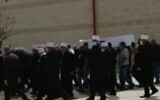 Screen capture from video of a funeral in the Arab Israeli town of Isfiya, April 15, 2020. (Channel 12 news)