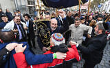 Jews dance with a Torah during the rededication of a synagogue in Konstanz, Germany in November 2019. (Felix Kästle/picture alliance via Getty Images via JTA)