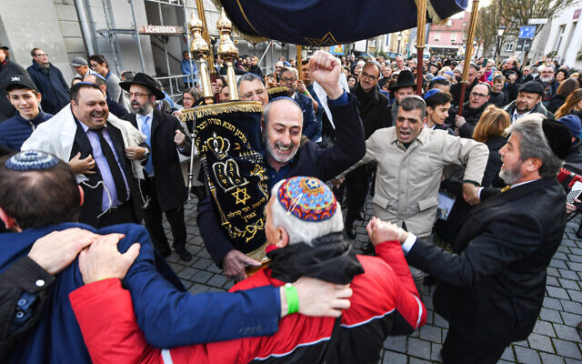 Jews dance with a Torah during the rededication of a synagogue in Konstanz, Germany in November 2019. (Felix Kästle/picture alliance via Getty Images via JTA) Jews dance with a Torah during the rededication of a synagogue in Konstanz, Germany in November 2019. (Felix Kästle/picture alliance via Getty Images via JTA)