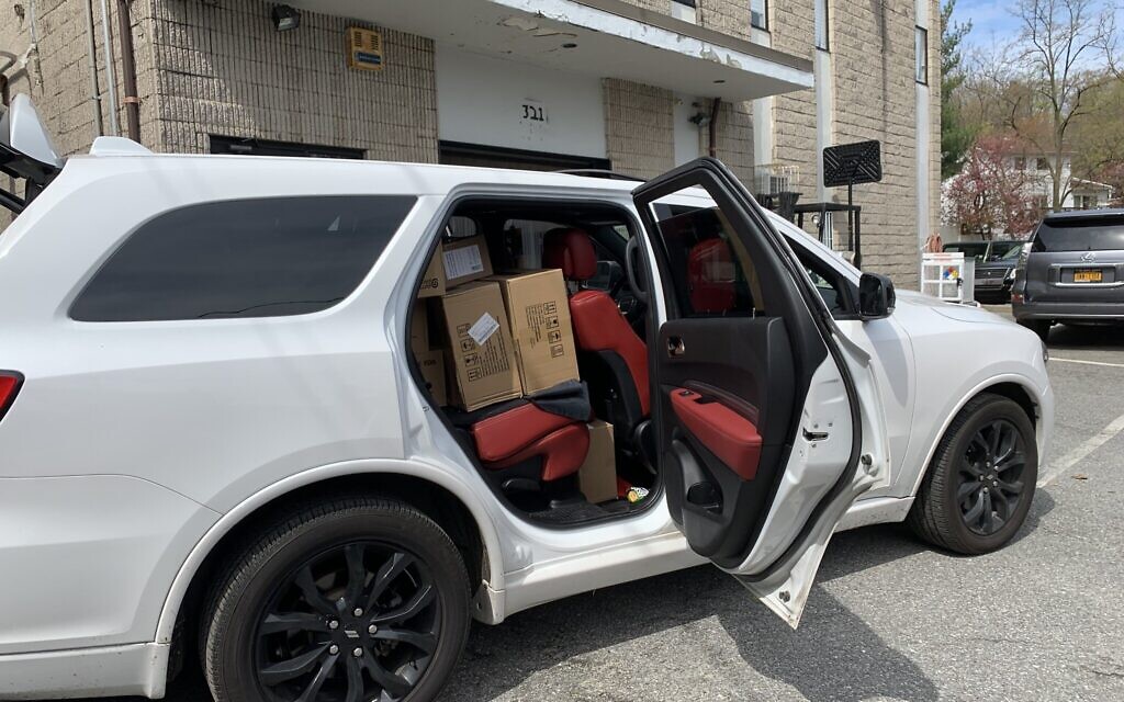 A car full of supplies sourced by Beit Midrash of Great Neck and destined for New York area hospitals, nursing homes, and emergency responders. (Cathryn J. Prince/ Times of Israel)
