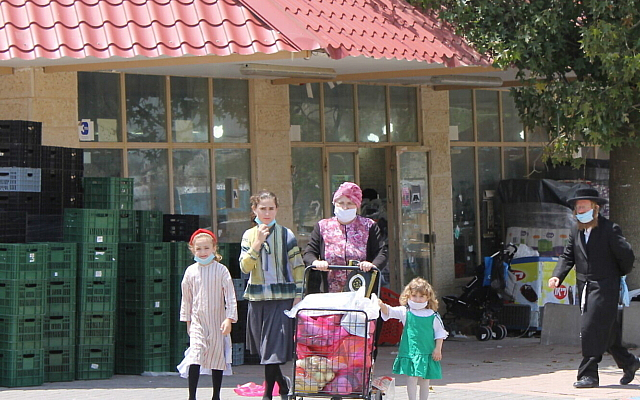 Residents walk in the Hasidic enclave of Ramat Beit Shemesh Bet under lockdown, April 27, 2020. (Sam Sokol/Times of Israel) Residents walk in the Hasidic enclave of Ramat Beit Shemesh Bet under lockdown, April 27, 2020. (Sam Sokol/Times of Israel)