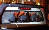The damaged rear window of a Jerusalem municipality vehicle that had stones thrown at it, April 4, 2020 (Magen David Adom)
