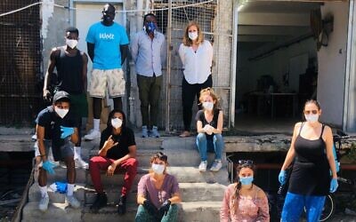 Leah Hecht and other volunteers assembling and delivering food packages in south Tel Aviv, April 3, 2020 (Courtesy ARDC)