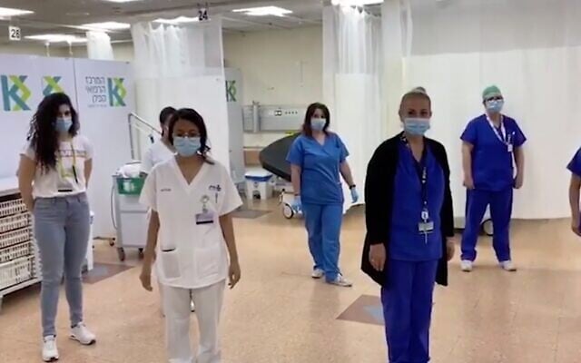 Screen capture from video of medical staff at the Sheba Medical Center observing a minute of silence for Suzy Levi, a nurse at the hospital who died of COVID-19, April 27, 2020. (Ynet) Screen capture from video of medical staff at the Sheba Medical Center observing a minute of silence for Suzy Levi, a nurse at the hospital who died of COVID-19, April 27, 2020. (Ynet)