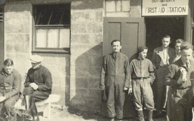 Residents standing outside the first aid building at the Kitchener Camp, in 1939 or 1940. (Wiener Holocaust Library Collections)