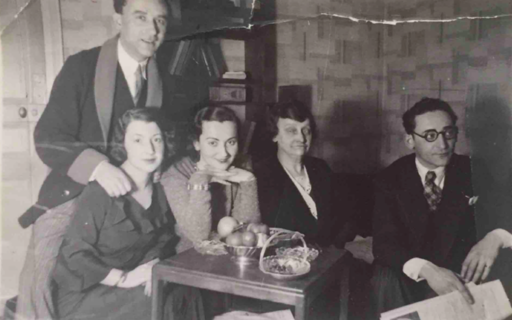 From left: Henri Glass standing behind his wife Sonia, Sala Glass, Chaya Glass and Jacques Glass in Henri and Sonia's Paris apartment shortly after their marriage. (Courtesy of Hadley Freeman)