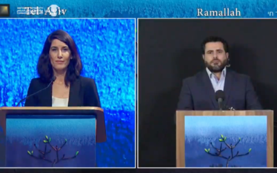 Emcees Maya Katz (L) and Osama Iliwat speak during a joint Israeli-Palestinian Memorial Day ceremony on April 27, 2020. (Rami Ben Ari/Combatants for Peace)