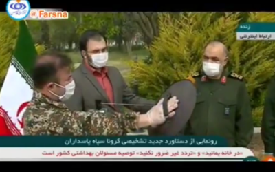 Islamic Revolutionary Guard Corps officers present what they claim is a 'smart device' capable of detecting coronavirus from a radius of 100 meters within five seconds. (Screen grab: FARS)