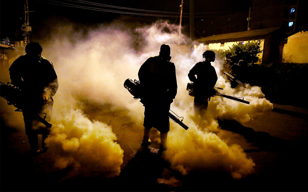 Members of a privately funded non-governmental organization working with county officials disinfect a street in the Kibera slum of Nairobi, Kenya, April 9, 2020. (AP/Brian Inganga) Members of a privately funded non-governmental organization working with county officials disinfect a street in the Kibera slum of Nairobi, Kenya, April 9, 2020. (AP/Brian Inganga)
