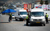 Police at a temporary checkpoint in the northern Arab Israeli town of Deir al-Asad, April 15, 2020. (Basel Awidat/Flash90)