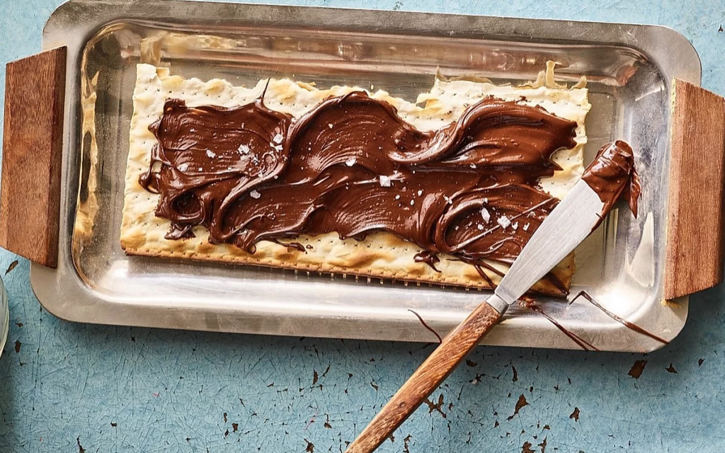 Adeena Sussman's Olive Oil Chocolate Spread on matzah, from the 'Sababa' cookbook (Courtesy Adeena Sussman) Adeena Sussman's Olive Oil Chocolate Spread on matzah, from the 'Sababa' cookbook (Courtesy Adeena Sussman)