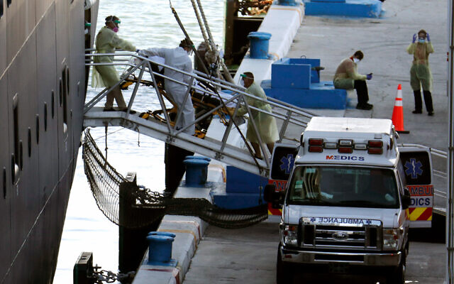 A person on a stretcher is removed from Carnival's Holland America cruise ship Zaandam at Port Everglades during the coronavirus pandemic, April 2, 2020, in Fort Lauderdale, Florida. (AP Photo/Lynne Sladky) A person on a stretcher is removed from Carnival's Holland America cruise ship Zaandam at Port Everglades during the coronavirus pandemic, April 2, 2020, in Fort Lauderdale, Florida. (AP Photo/Lynne Sladky)