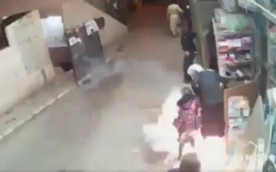 A stun grenade thrown by police hits a 9-year-old girl during riots in the ultra-Orthodox neighborhood of Mea Shearim on April 16, 2020. (Screenshot: Twitter)