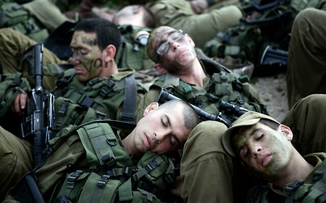 IDF troops snooze following a 40-kilometer hike, February 16, 2010. (Abir Sultan/Flash90) IDF troops snooze following a 40-kilometer hike, February 16, 2010. (Abir Sultan/Flash90)