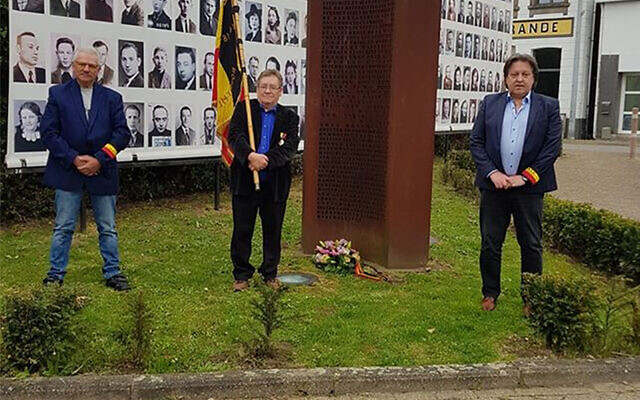 Michel Baert, right, and two commemoration activists laying a wreath at a Holocaust monument in Boortmeerbeek, Belgium on April 19, 2020. (Michel Baert via JTA) Michel Baert, right, and two commemoration activists laying a wreath at a Holocaust monument in Boortmeerbeek, Belgium on April 19, 2020. (Michel Baert via JTA)