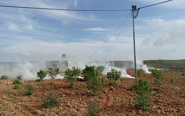 Tear gas fired as settlers and Palestinians fight near the West Bank town of Qusra on April 6, 2020. (Courtesy: Qusra Municipality) Tear gas fired as settlers and Palestinians fight near the West Bank town of Qusra on April 6, 2020. (Courtesy: Qusra Municipality)