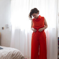Clothing designer Anat Friedman modeling her 2020 spring collection, after the coronavirus shuttered her store and studio (Courtesy Adir Alharar)