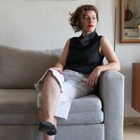 Clothing designer Anat Friedman modeling her 2020 spring collection, after the coronavirus shuttered her store and studio (Courtesy Adir Alharar)