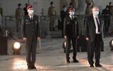President Reuven Rivlin and military chiefs wear protectives mask during the national opening ceremony for Israel's Memorial Day for fallen soldiers and victims of terror, at the Western Wall in Jerusalem, April 27, 2020 (Amos Ben Gershom / GPO)