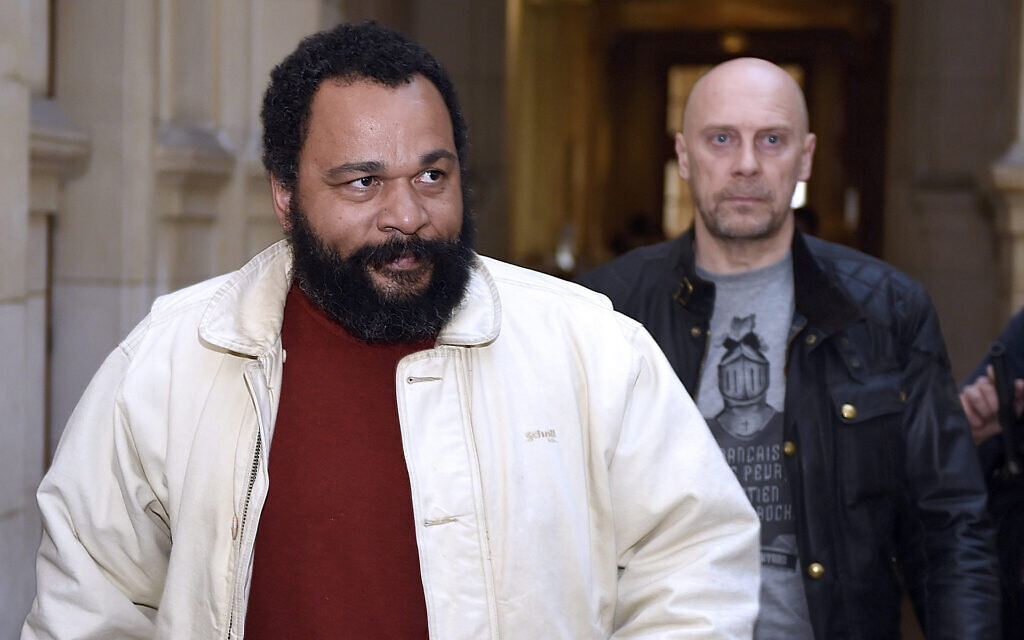 Dieudonne M'bala M'bala, left, and Alain Soral arrive at the Paris courthouse for Soral's trial for inciting hatred against Jews, March 12, 2015. (Loic Venance/AFP via Getty Images/ JTA) Dieudonne M'bala M'bala, left, and Alain Soral arrive at the Paris courthouse for Soral's trial for inciting hatred against Jews, March 12, 2015. (Loic Venance/AFP via Getty Images/ JTA)