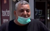 Yuval Carmi, a falafel store owner in Ashdod who has been hit hard by the pandemic, April 19, 2020. (screen capture: Channel 13)