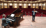 Pianist Marc Wielart and violinist Eduardo Paredes Crespo playing Israel's national anthem at the Concergebouw hall in Amsterdam, the Netherlands in April 2020. (Courtesy of Barry Mehler via JTA)