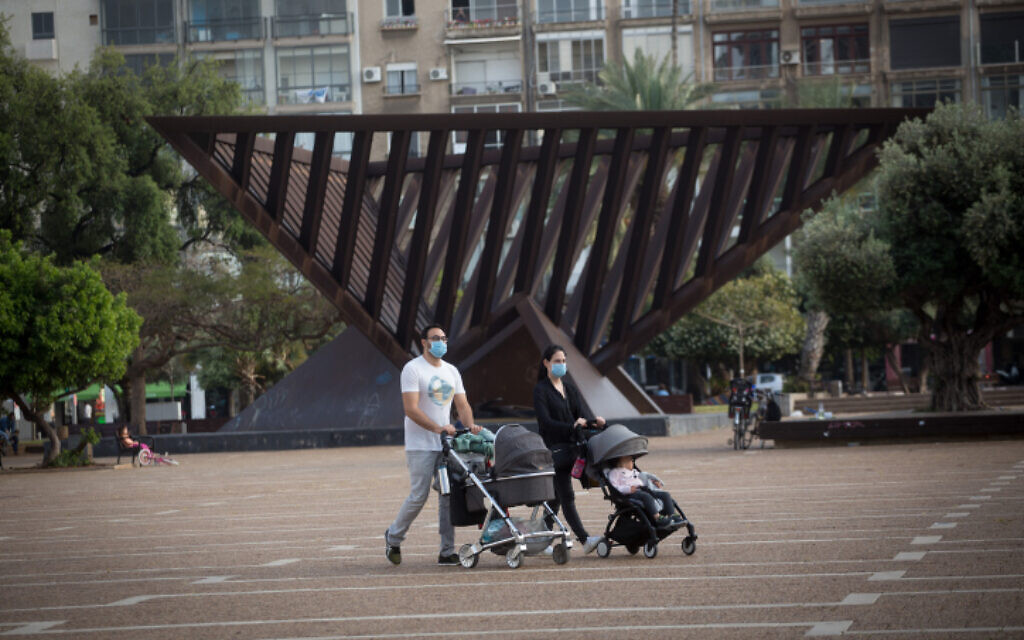 People wear protective masks at Rabin Square in Tel Aviv, on April 18, 2020 (Miriam Alster/FLASH90) People wear protective masks at Rabin Square in Tel Aviv, on April 18, 2020 (Miriam Alster/FLASH90)