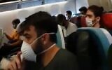 Students fly back to Israel from Turkey, April 8, 2020 (Screen grab/Kan)