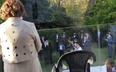 Dozens attend a Jewish wedding in Golders Green in London, on April 22, 2020 during the coronavirus pandemic (Screen grab/MailOnline)
