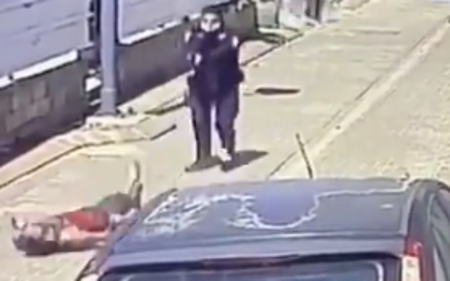 A man is shot by a police officer in an apparent attempted stabbing incident in the central city of Rosh Haayin, April 30, 2020. (Screen capture: Twitter) A man is shot by a police officer in an apparent attempted stabbing incident in the central city of Rosh Haayin, April 30, 2020. (Screen capture: Twitter)