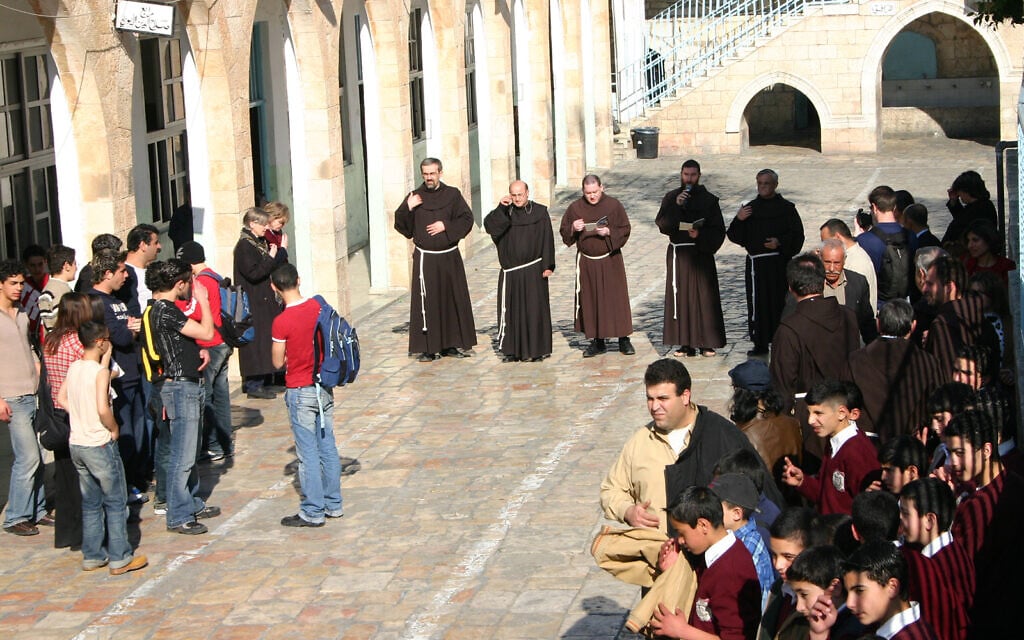 Franciscan priests lead a procession through the Via Dolorosa on a Friday in Jerusalem's Old City. (Shmuel Bar-Am)