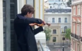 A violinist playing the Israeli national anthem on his balcony in Madrid amid the COVID-19 lockdown. (Screen capture: Instagram)