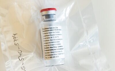 A vial of the drug remdesivir is viewed during a press conference about the start of a study with the drug in particularly severely ill patients at the University Hospital Eppendorf (UKE) in Hamburg, northern Germany, April 8, 2020, amidst the coronavirus pandemic.  (Ulrich Perrey / POOL / AFP)