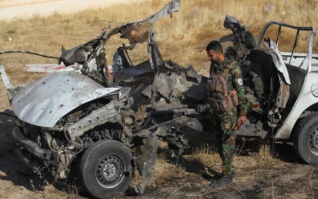 An Iraqi fighter with the Hashed al-Shaabi (Popular Mobilisation Forces) inspects the site of an Islamic State attack, a day earlier, on a unit of the paramilitary force in Mukaishefah, about 180 kilometers north of the capital, Baghdad, May 3, 2020. (AHMAD AL-RUBAYE / AFP) An Iraqi fighter with the Hashed al-Shaabi (Popular Mobilisation Forces) inspects the site of an Islamic State attack, a day earlier, on a unit of the paramilitary force in Mukaishefah, about 180 kilometers north of the capital, Baghdad, May 3, 2020. (AHMAD AL-RUBAYE / AFP)