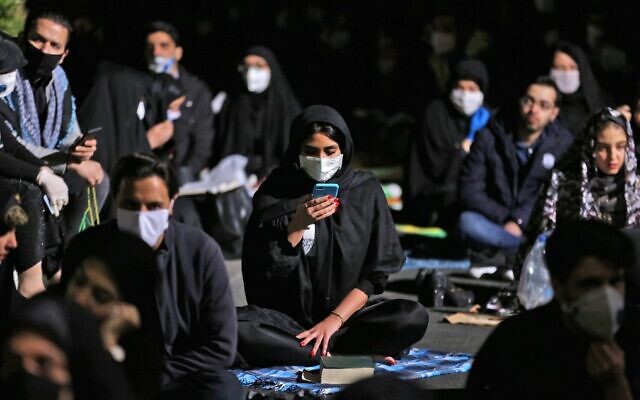 Iranians attend prayers for Laylat al-Qadr, one of the holiest nights during the Muslim fasting month of Ramadan, outside a mosque in the Tehran, on May 13, 2020. (Atta Kenare/AFP) Iranians attend prayers for Laylat al-Qadr, one of the holiest nights during the Muslim fasting month of Ramadan, outside a mosque in the Tehran, on May 13, 2020. (Atta Kenare/AFP)