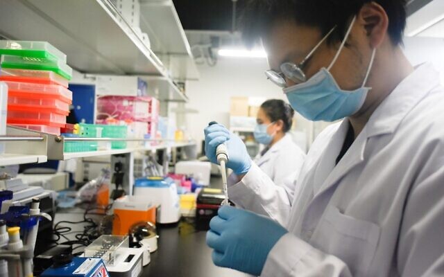 This picture taken on May 14, 2020, shows researchers at Peking University's Beijing Advanced Innovation Center for Genomics conducting tests at their laboratory in Beijing. (Wang Zhao/AFP) This picture taken on May 14, 2020, shows researchers at Peking University's Beijing Advanced Innovation Center for Genomics conducting tests at their laboratory in Beijing. (Wang Zhao/AFP)