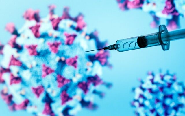 A syringe injects an illustrated representation of COVID-19, the disease caused by the novel coronavirus, in Paris, on May 18, 2020. (JOEL SAGET/AFP) A syringe injects an illustrated representation of COVID-19, the disease caused by the novel coronavirus, in Paris, on May 18, 2020. (JOEL SAGET/AFP)