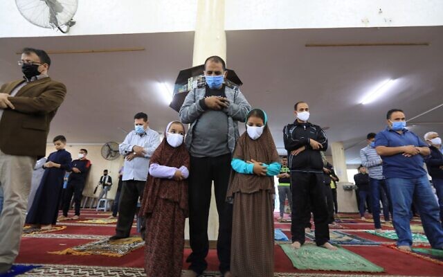 Palestinians perform an Eid al-Fitr prayer despite concerns over the COVID-19 coronavirus outbreak at a mosque in Gaza City early on May 24, 2020, after the local authorities allowed mosques to reopen amid the easing of some social distancing restrictions. (MAHMUD HAMS / AFP)